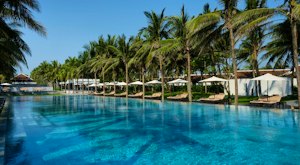 Experience a luxurious family summer getaway on Hoi An's white sandy beaches at a 5-star beachfront resort<place>Four Seasons Resort The Nam Hai, Hoi An, Vietnam</place><fomo>146</fomo>